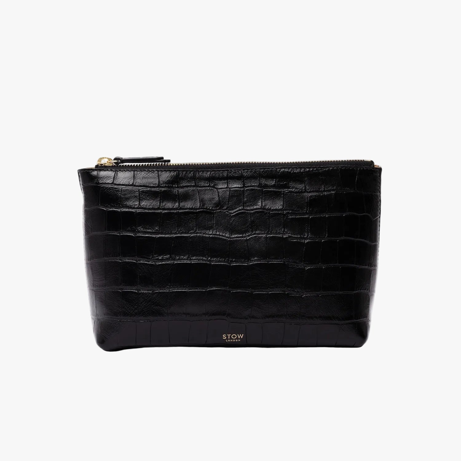 STOW London's travel pouch in Black Embossed Croc leather on a light grey background featuring a YKK zip and a fine gold embossed logo on the front