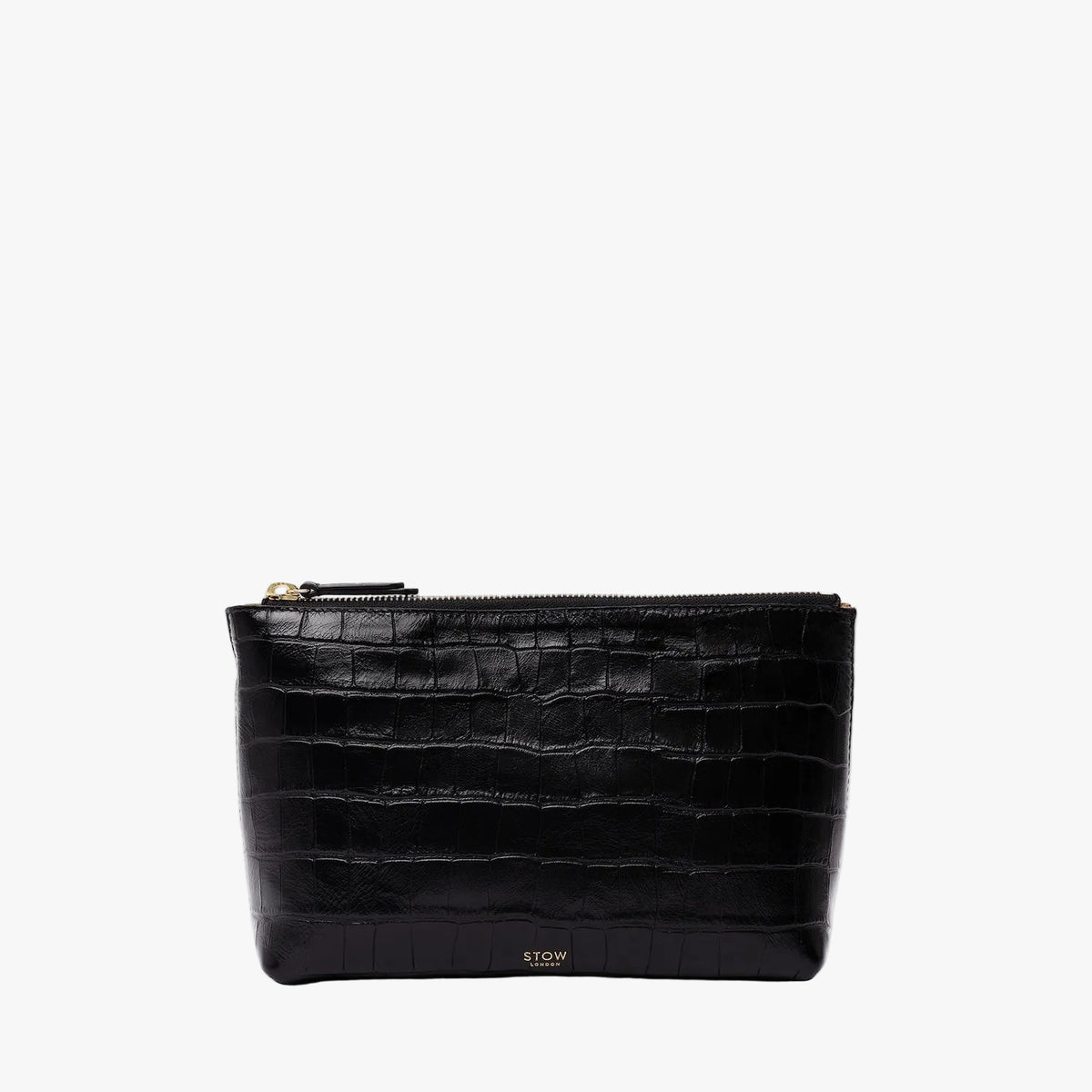 STOW London's travel pouch in Black Embossed Croc leather on a light grey background featuring a YKK zip and a fine gold embossed logo on the front