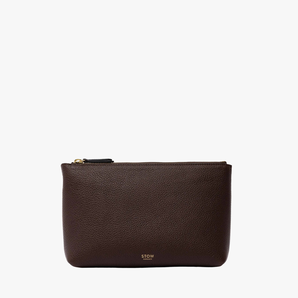 STOW London's travel pouch in Espresso pebbled leather on a light grey background featuring a YKK zip and a fine gold embossed logo on the front 