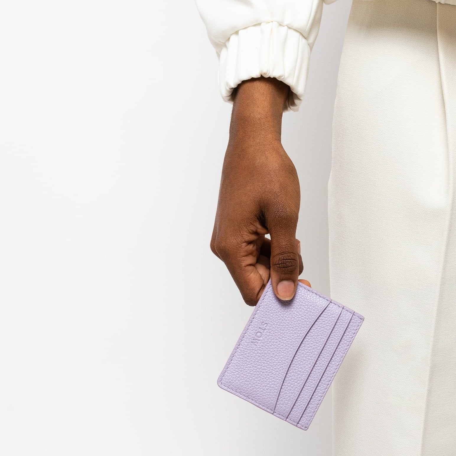 STOW London Leather Cardholder in Wild Lavender held by female model in studio