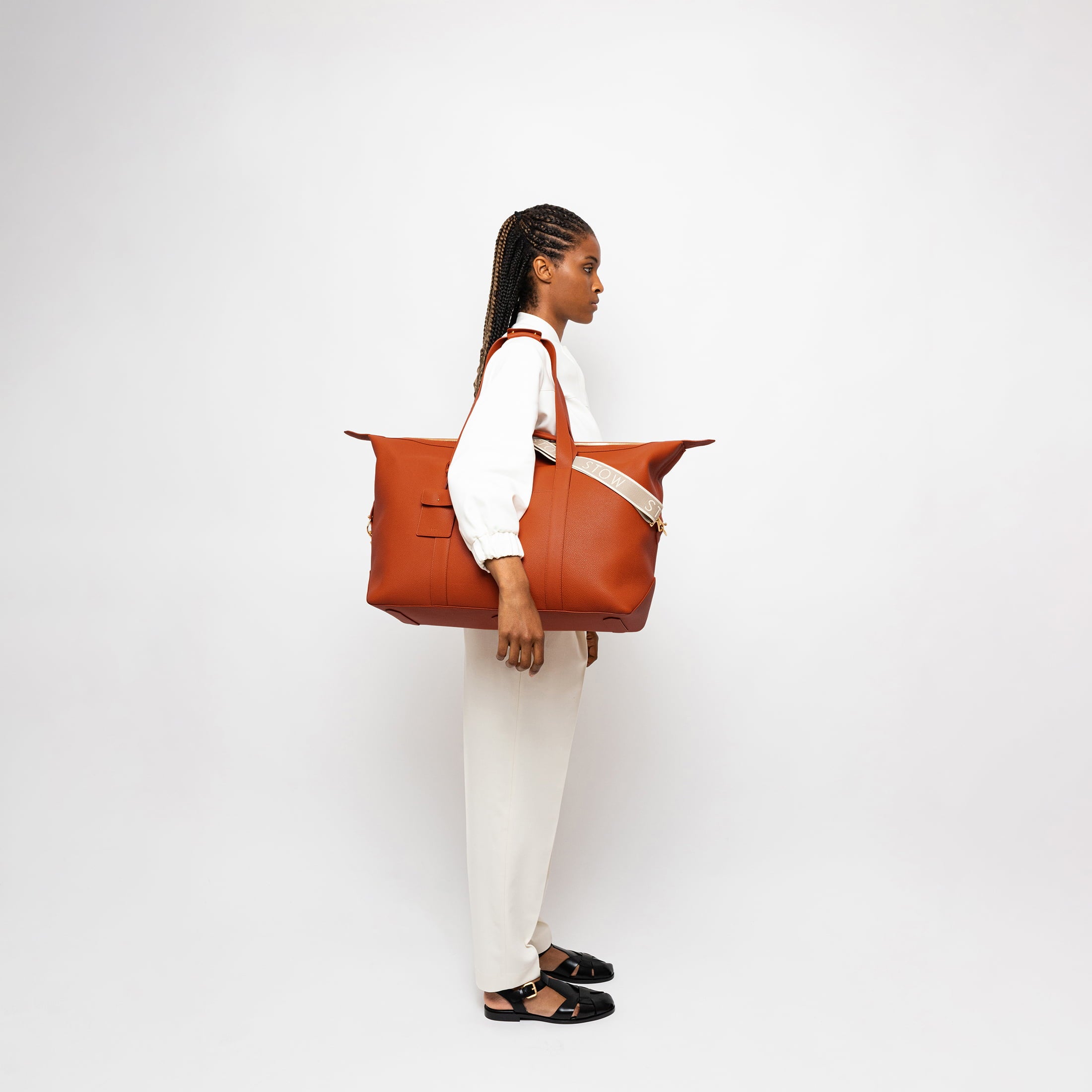 STOW Leather Weekend Bag in Clay Orange pebbled leather.