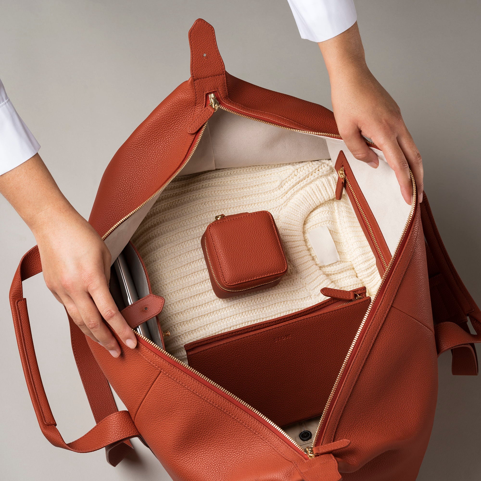 STOW Leather Weekend Bag in Clay Orange pebbled leather.