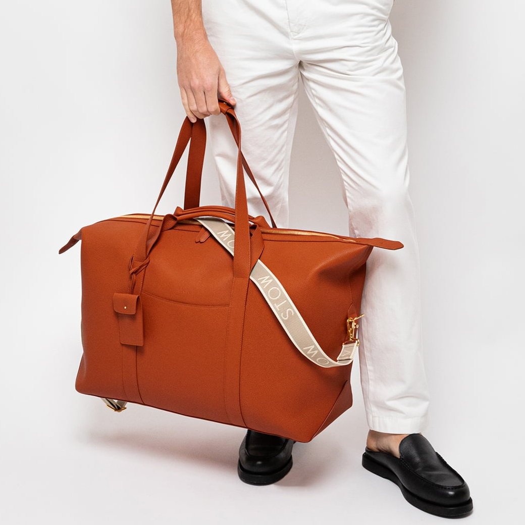 STOW Leather Weekend Bag in Clay Orange pebbled leather.