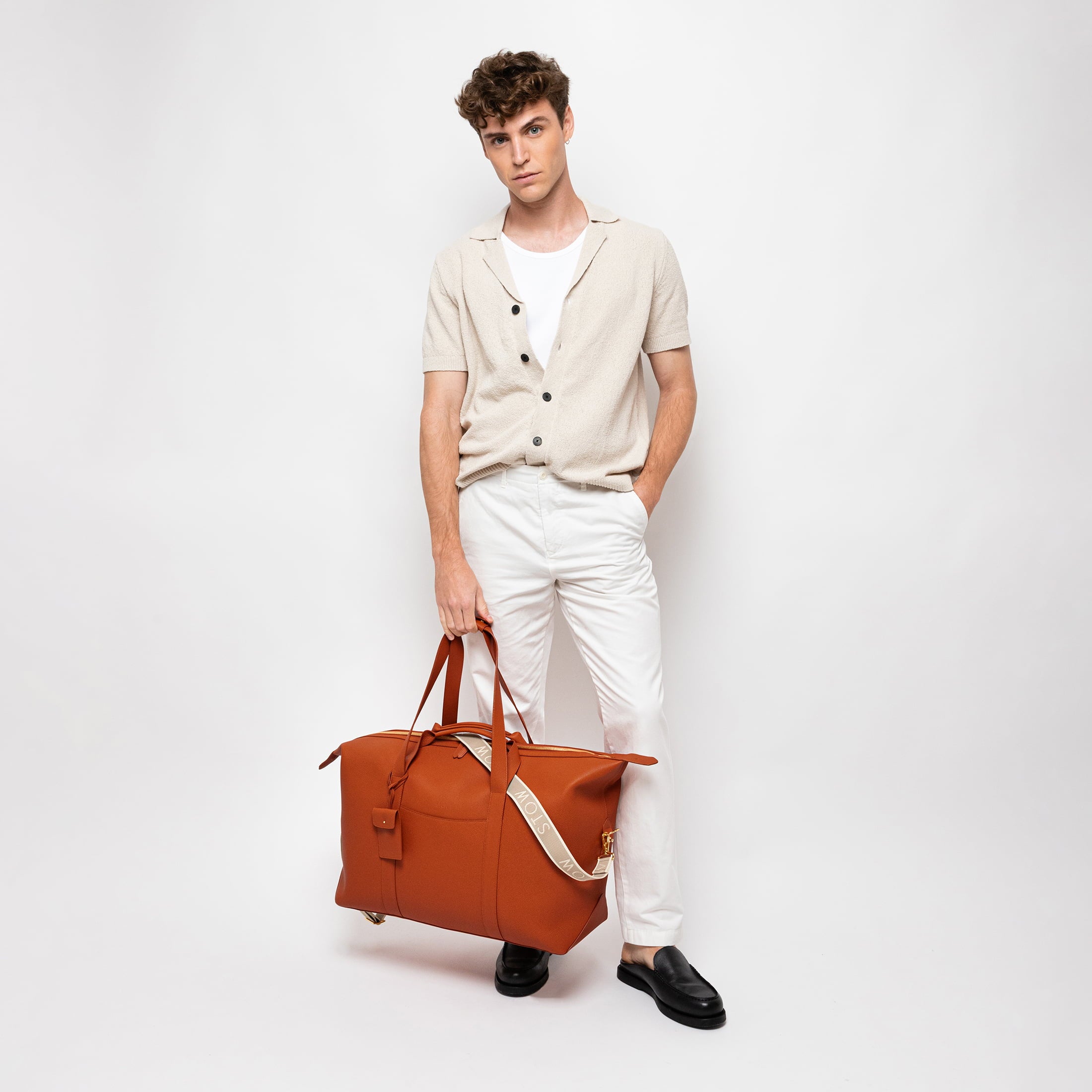 STOW Leather Weekend Bag in Clay Orange pebbled leather.