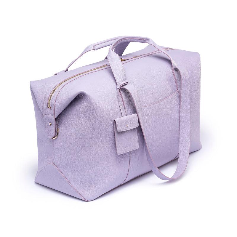 STOW Leather Multi Tag in Wild Lavender pebbled leather shown hanging on Wild Lavender Leather Weekend Bag by STOW.