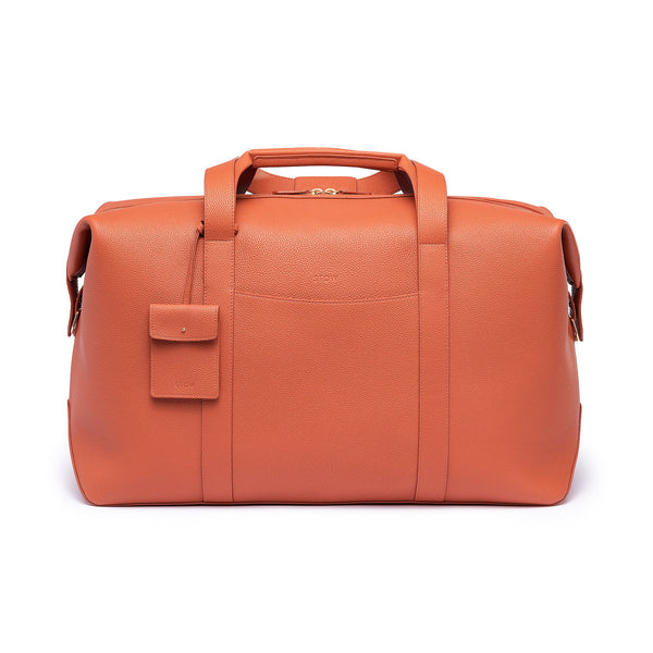 STOW Leather Weekend Bag in Clay Orange pebbled leather.