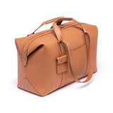 STOW Leather Multi Tag in Earth Tan pebbled leather shown hanging on Earth Tan Leather Weekend Bag by STOW.