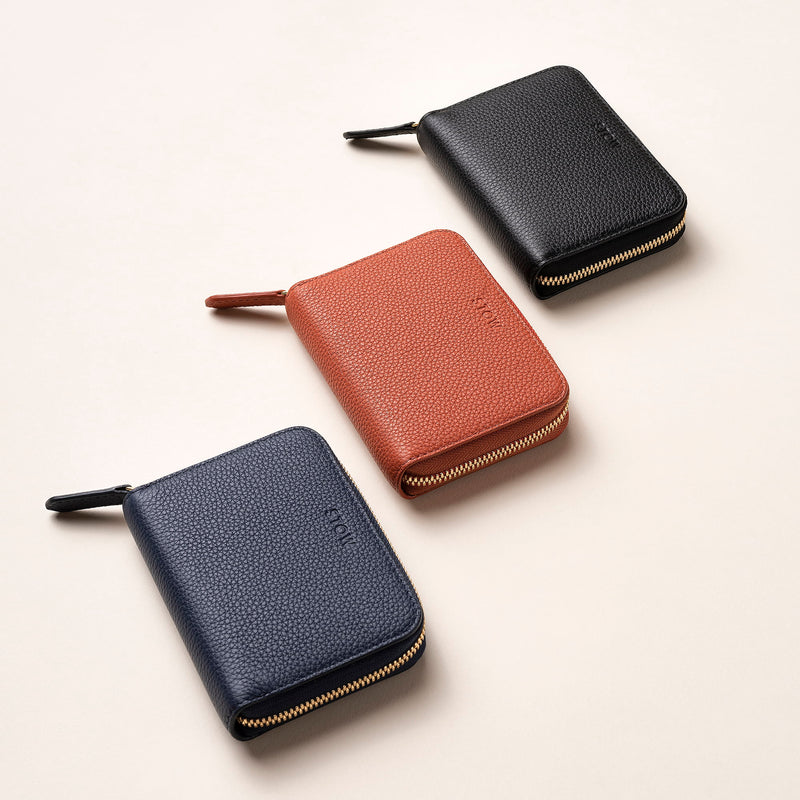 STOW Leather Zip Wallets in Black, Clay Orange and Navy pebbled leather.