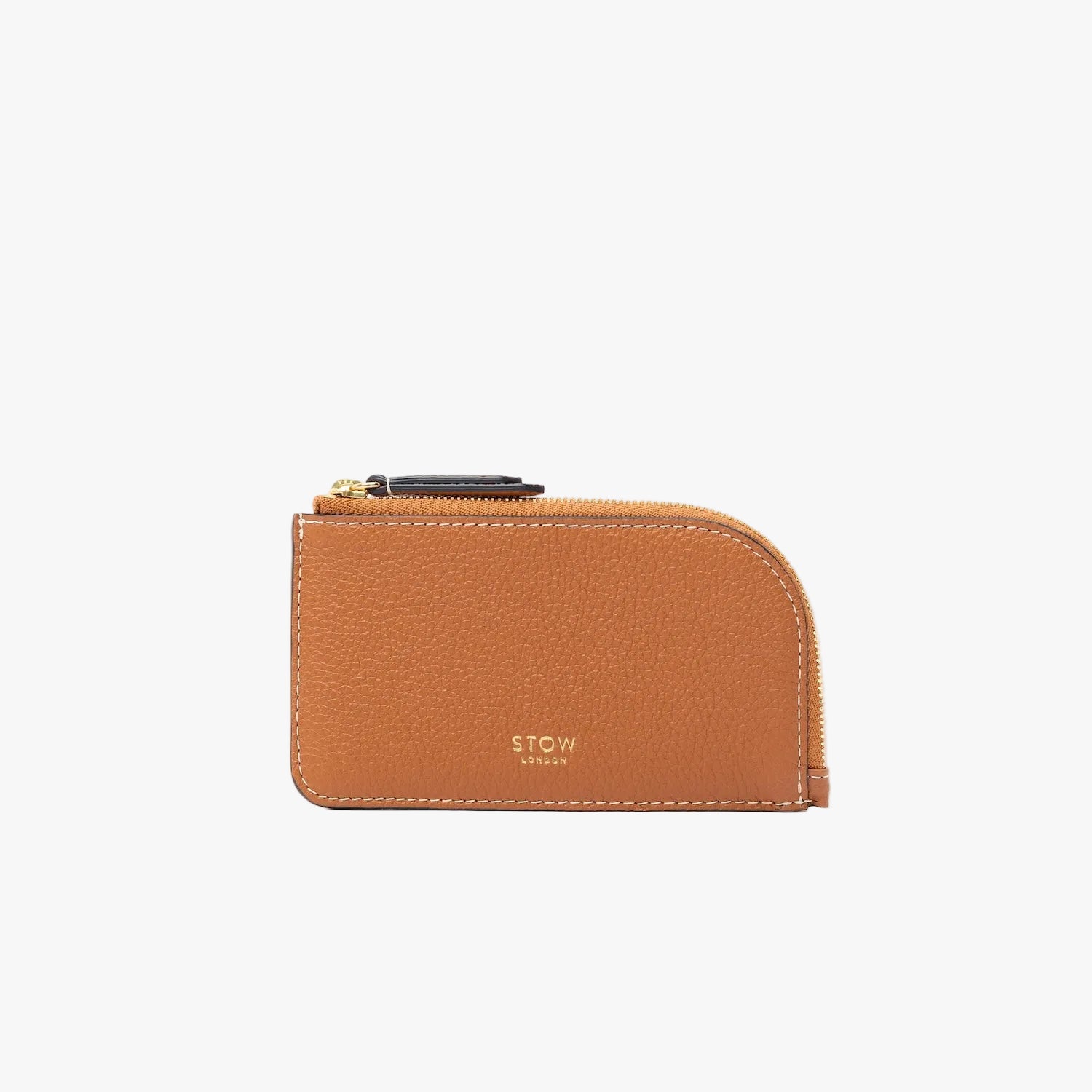 STOW London's Zip Wallet in Earth Tan pebbled leather on a light grey background featuring a fine gold embossed logo and YKK Natulon zipper